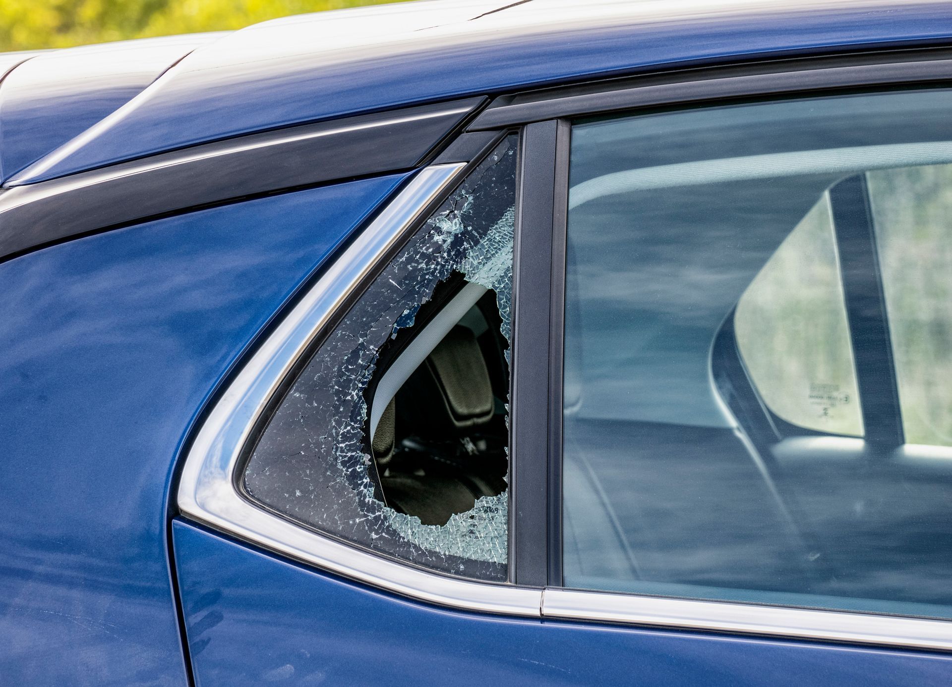 A close up of a car with a broken window