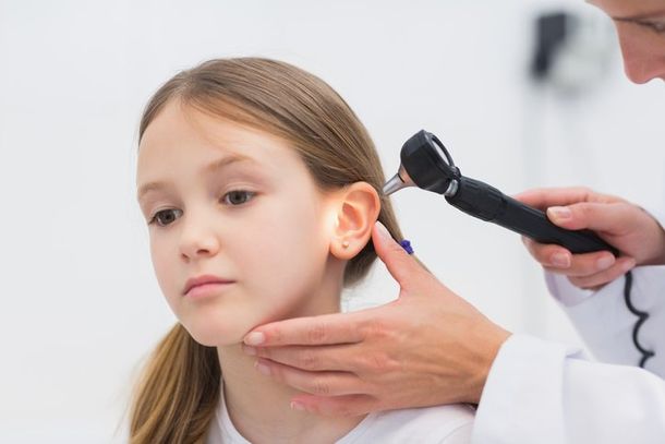 hearing aids — Young girl having ear examined by doctor in Cape May Court House, NJ