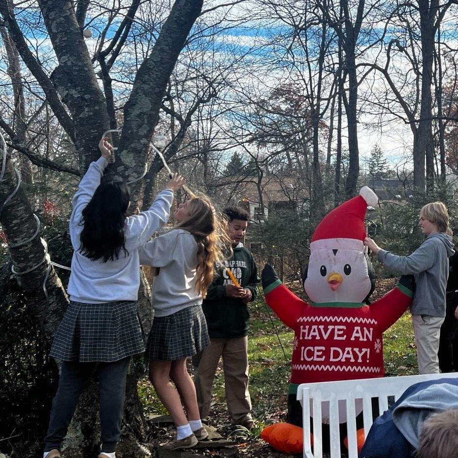 Two young boys holding a roll of bounty paper towels and toothbrushes
