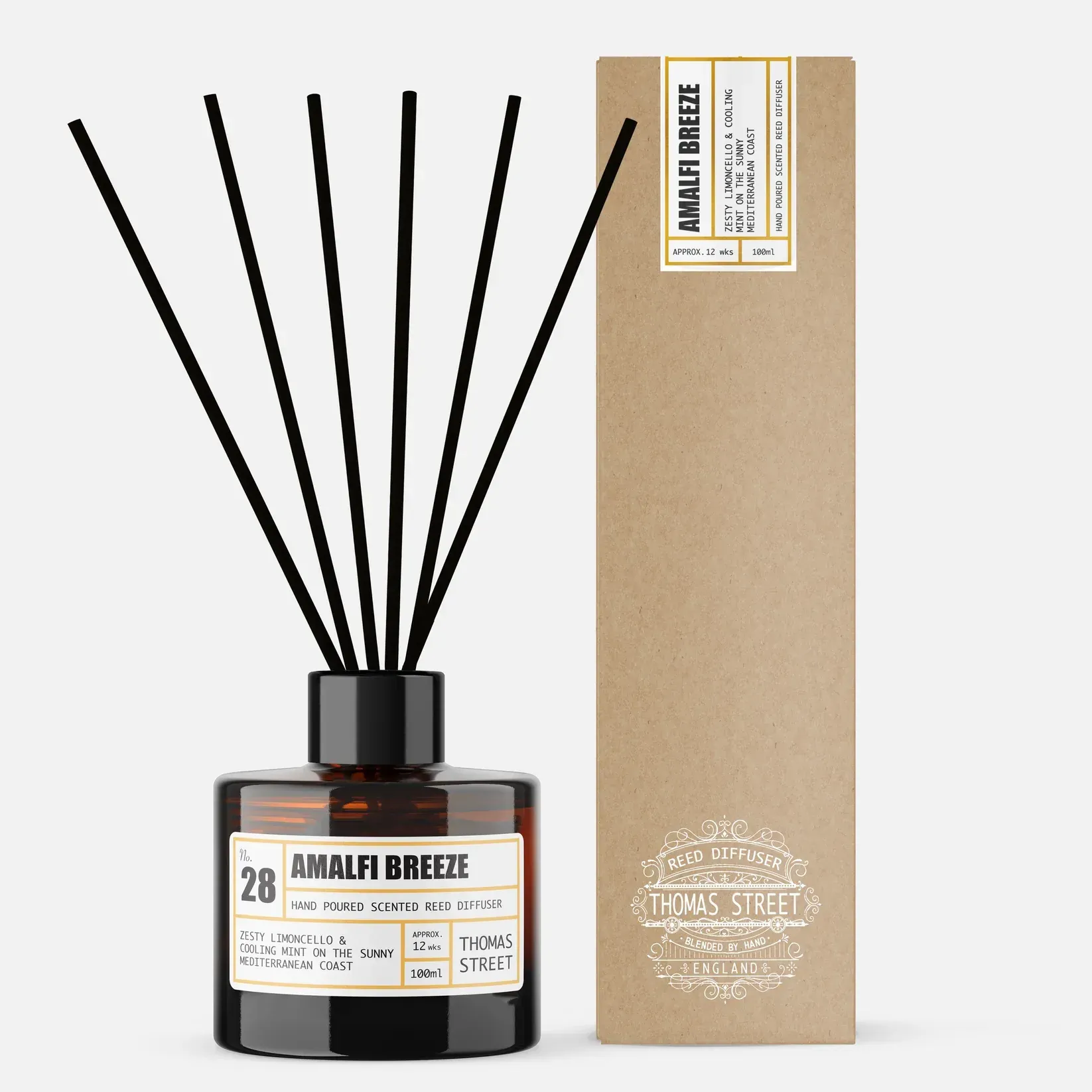 A bottle of amalfi breeze reed diffuser next to a box