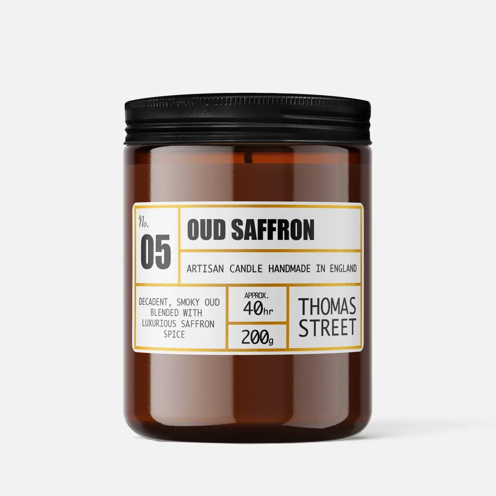 A jar of oud saffron candle made by thomas street