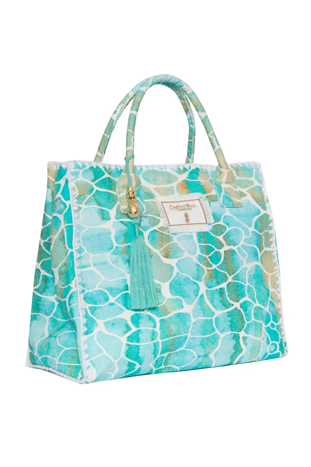 A blue and white tote bag with a tassel on a white background.