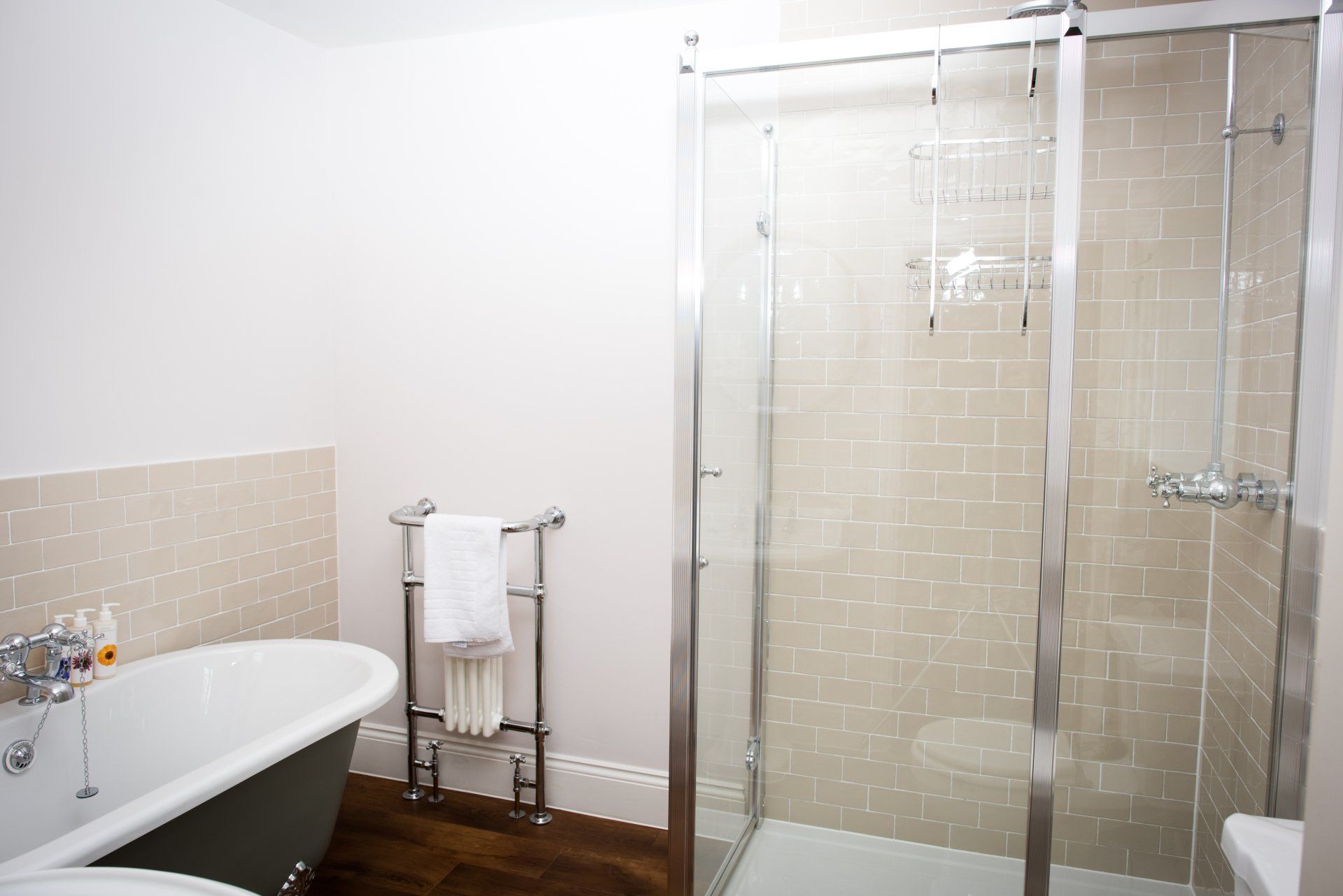 A bathroom with a bathtub and a walk in shower