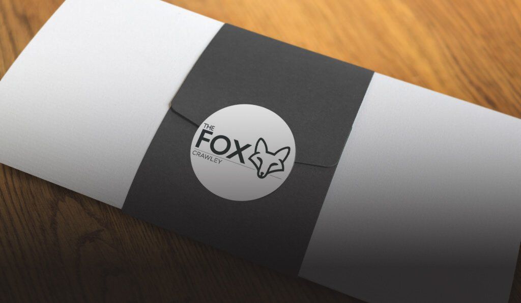 A black and white envelope with the word fox on it