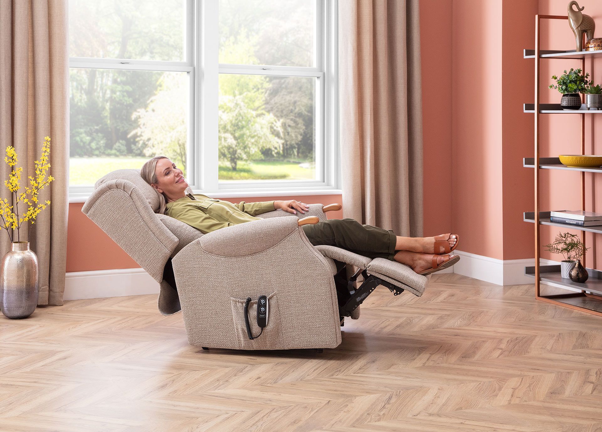 Woman reclining in beige lift chair in front of a window