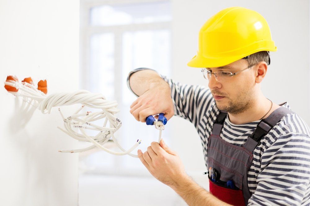 Electrician Working With Wires — Electrician in Tweed Heads, NSW