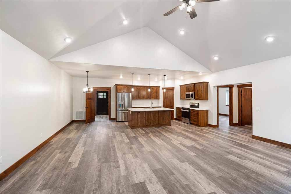 There is a ceiling fan in the living room and kitchen.