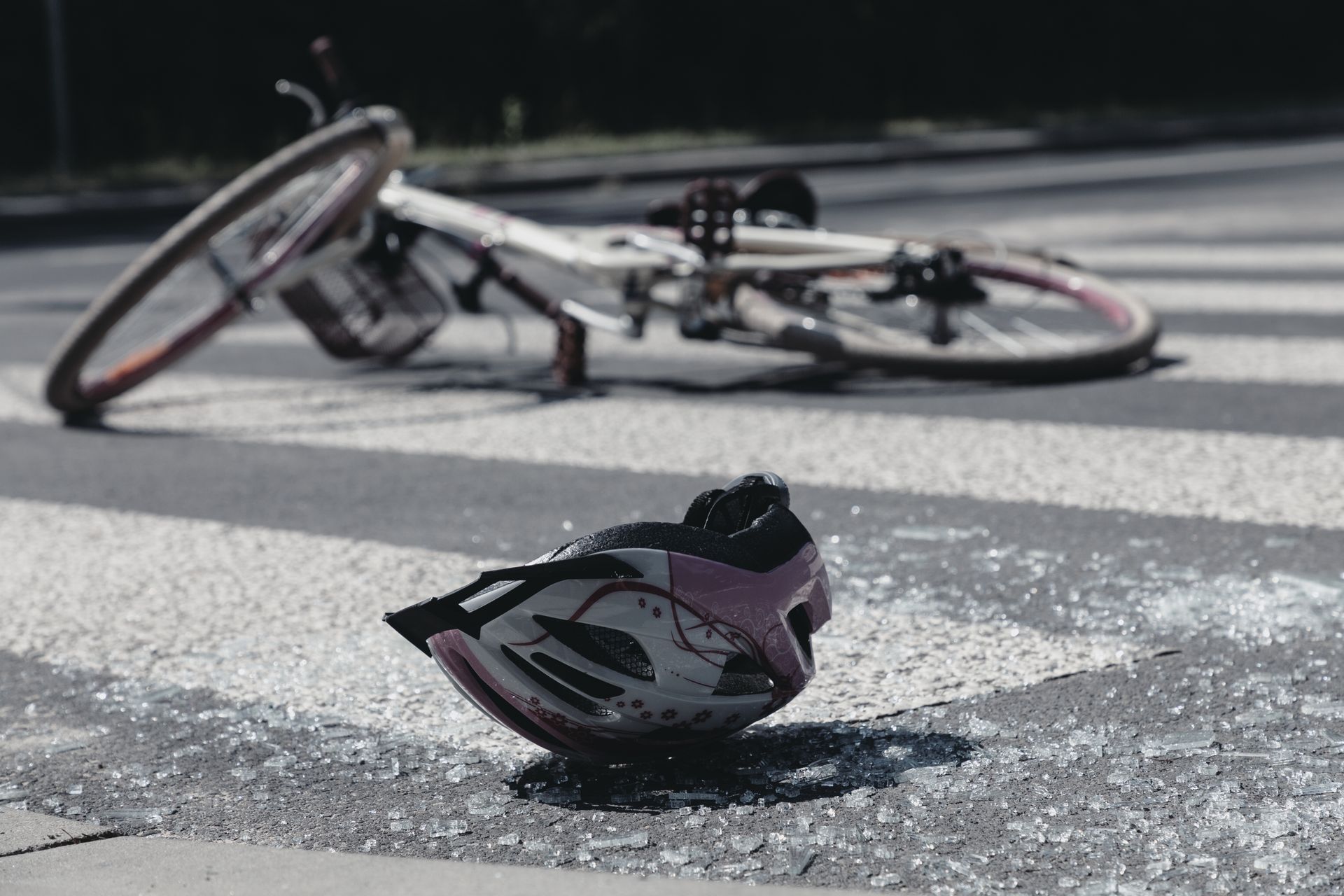 bicycle and helmet on crosswalk