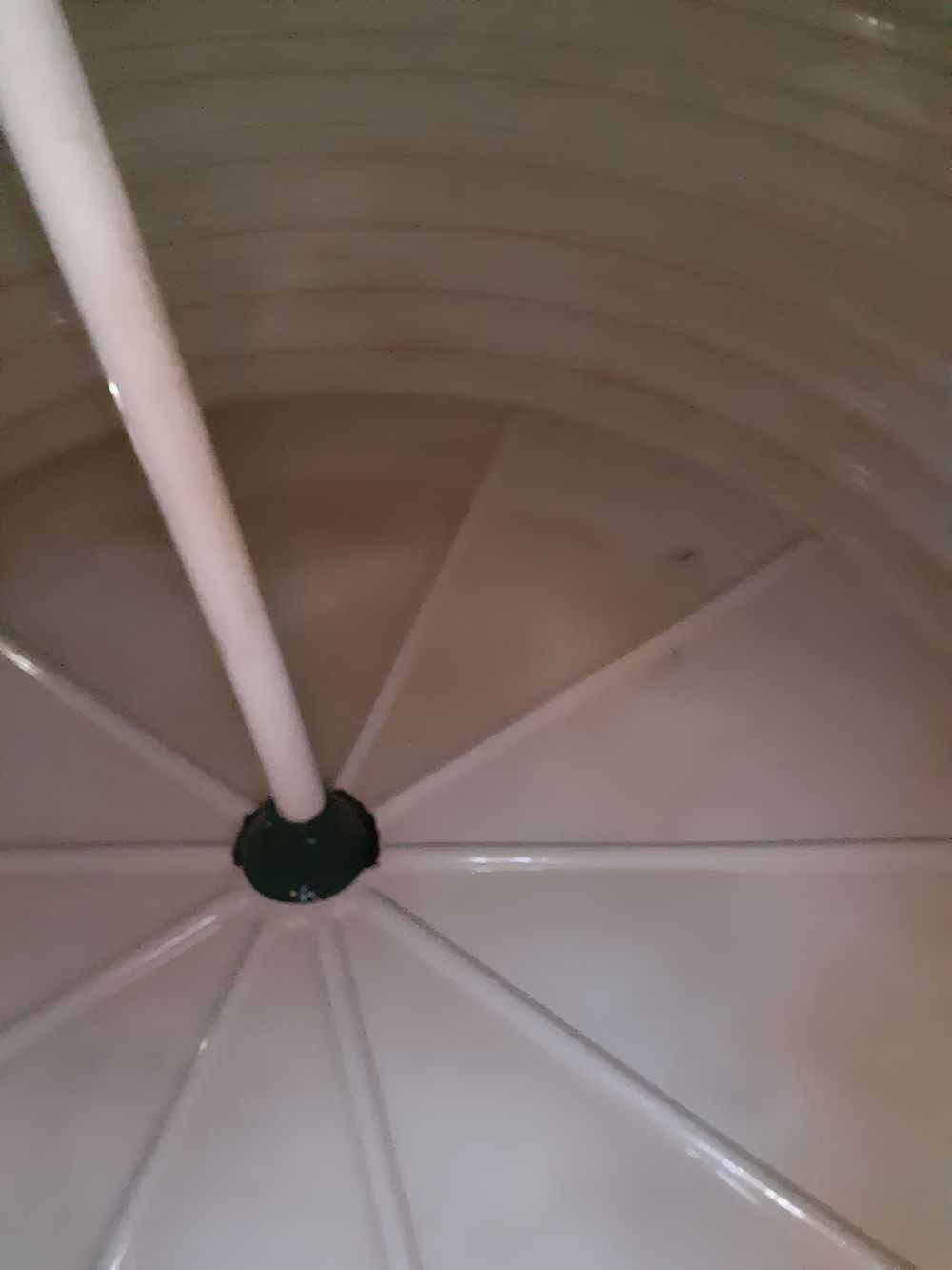 A Close Up of a White Water Tank With a White Pole in the Middle — Tink's Water Tank Cleaning in Harrington, NSW