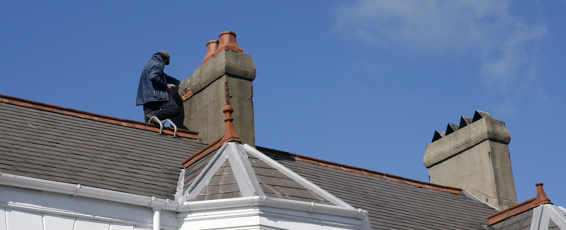 A man repairing a roof