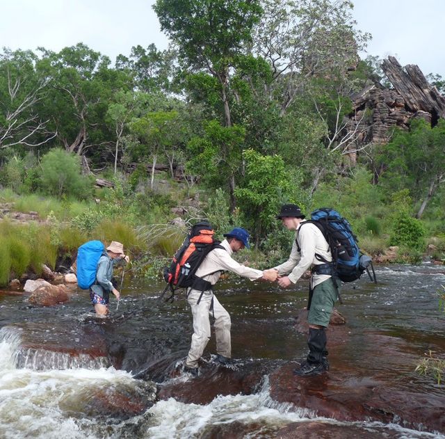 Crossing Baroalba (Burdulba) Creek on a wet season trek.
