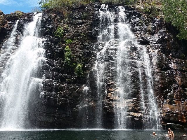 Kakadu, swimming below a wet season waterfall