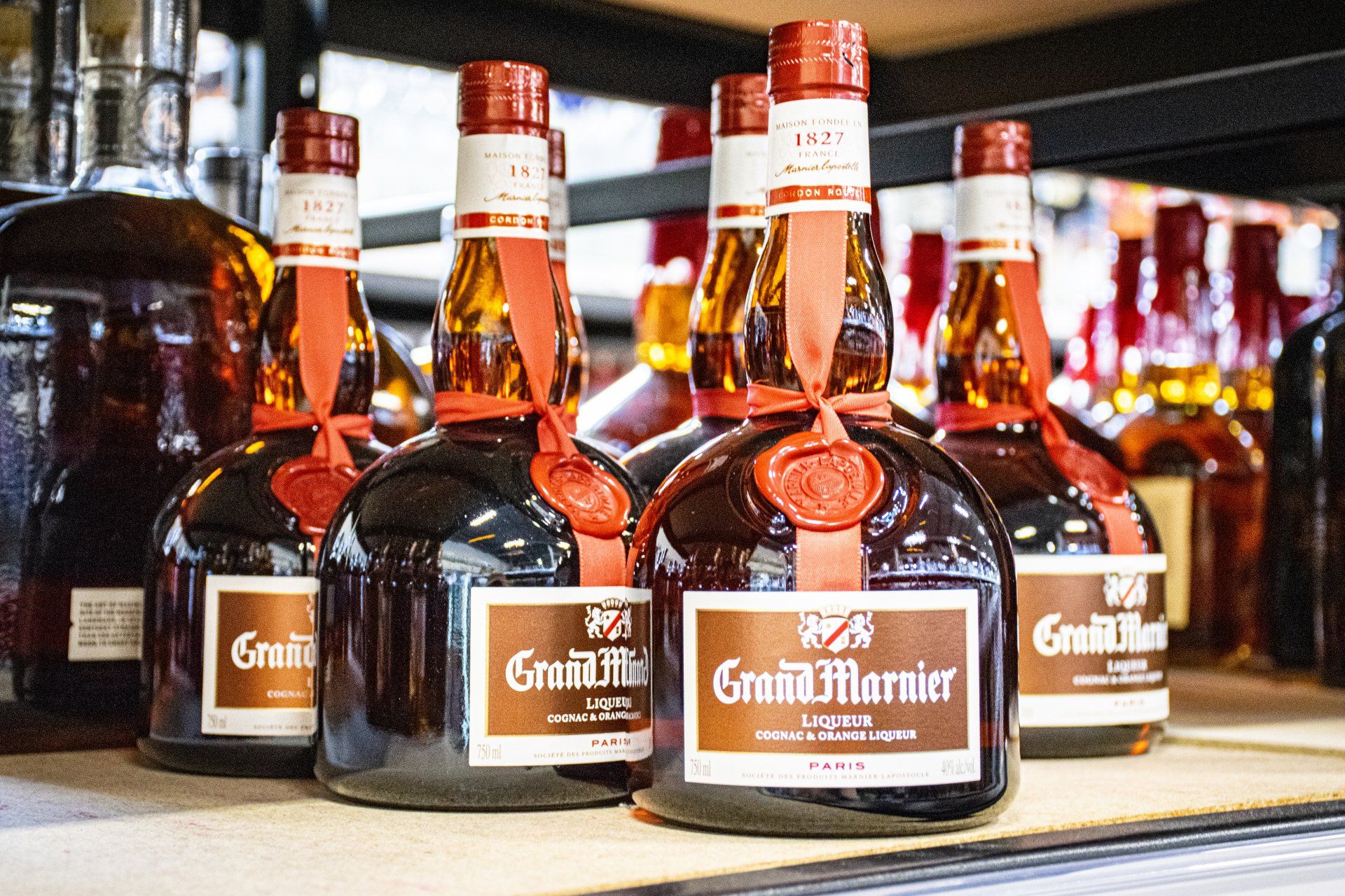 Bottles of Smith & Cross Jamaican Rum on a shelf, sealed with wax.