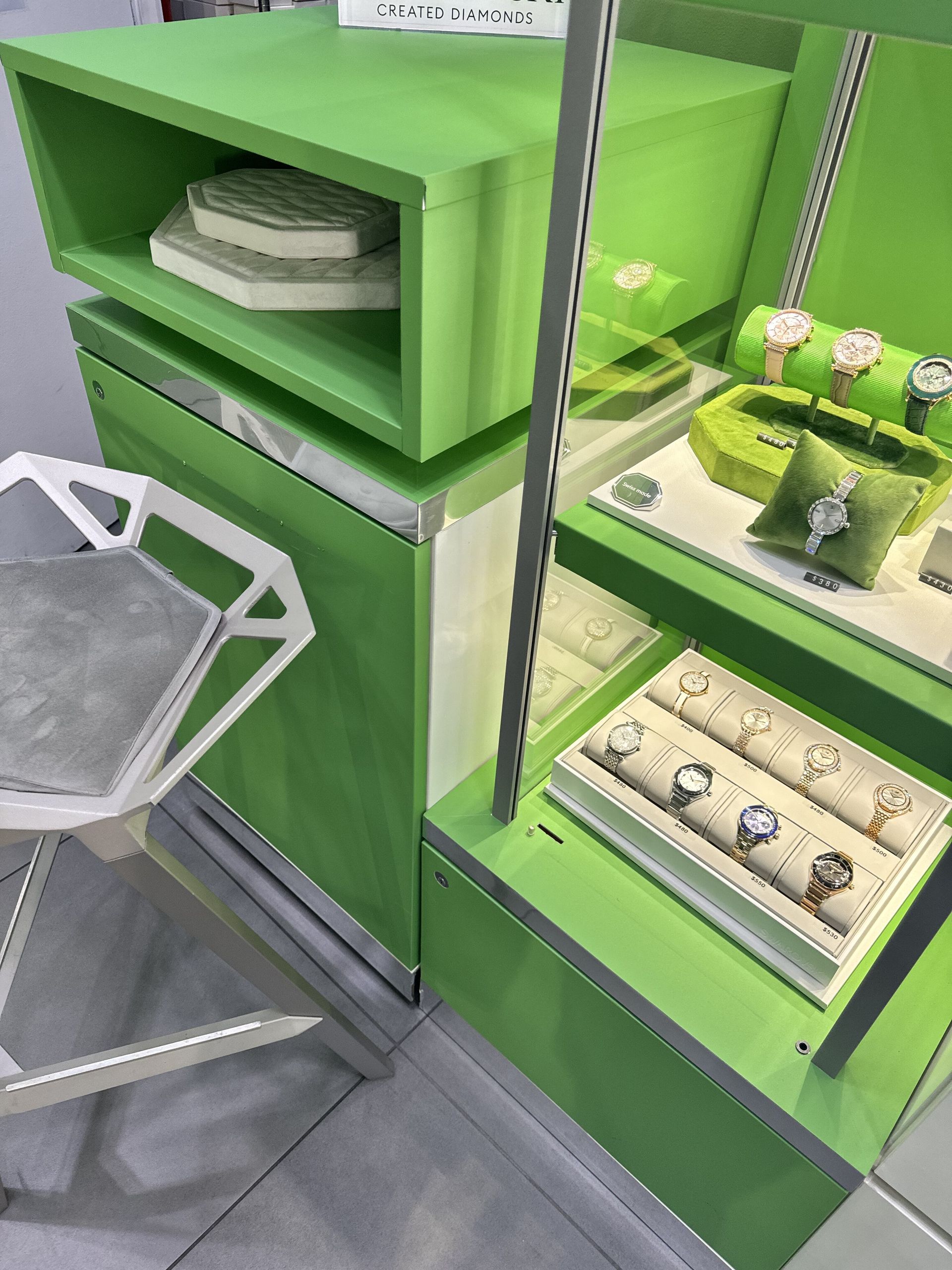 A white car is parked in a garage.