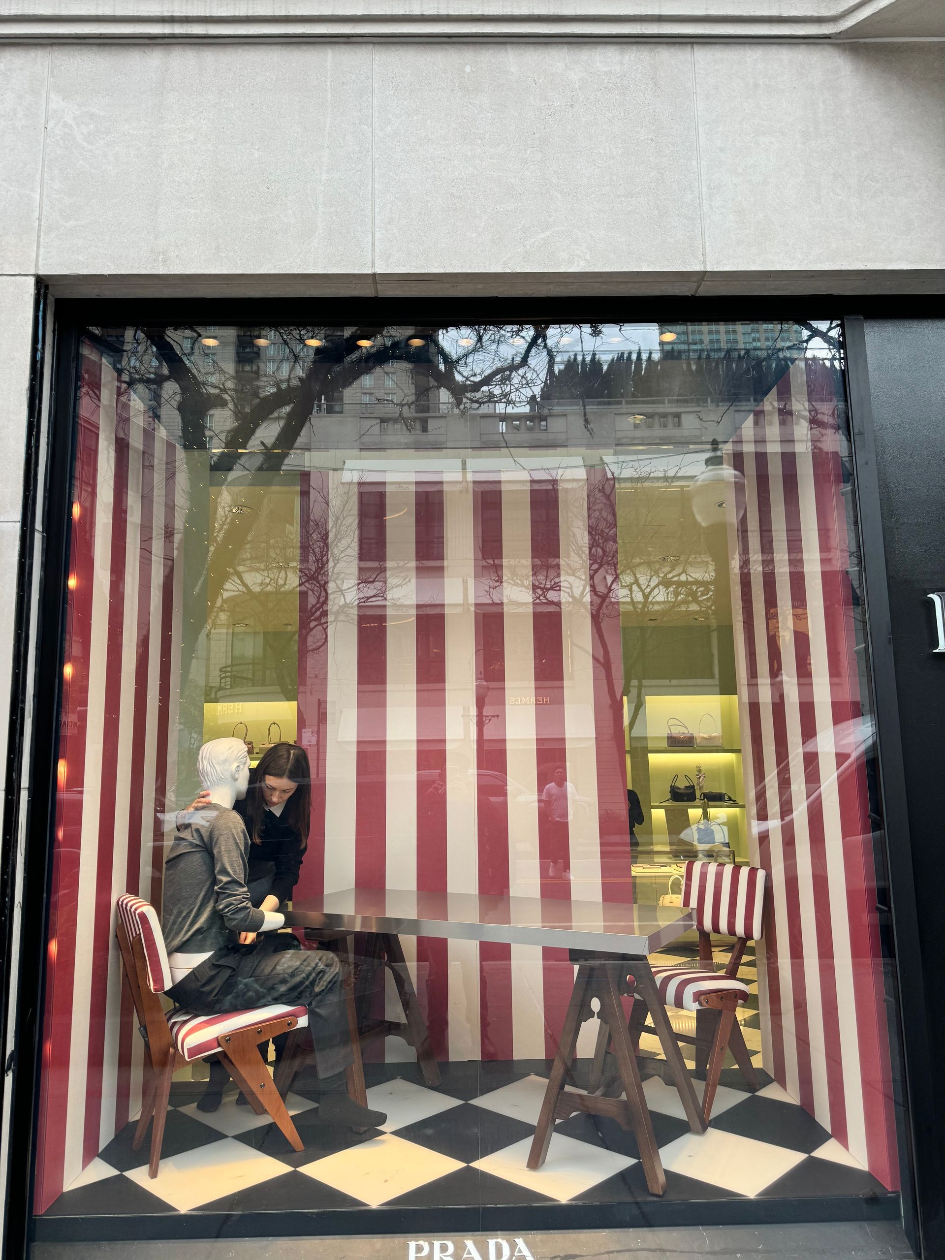 A white car is parked in a garage.