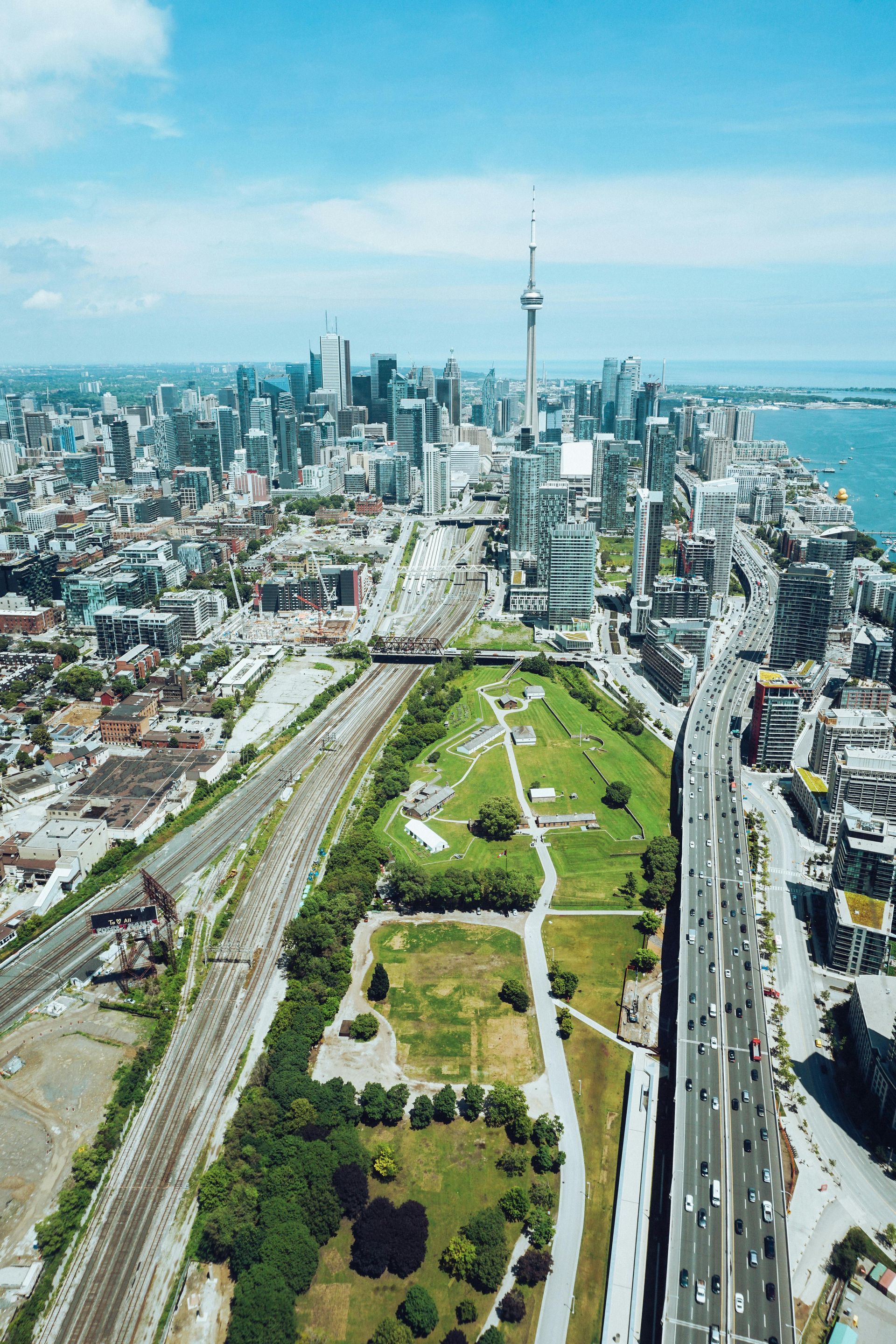 An aerial view of a city with a park in the middle of it.