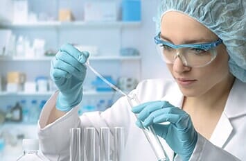 Female taking sample from test tube -  Drug testing in Highland, IN