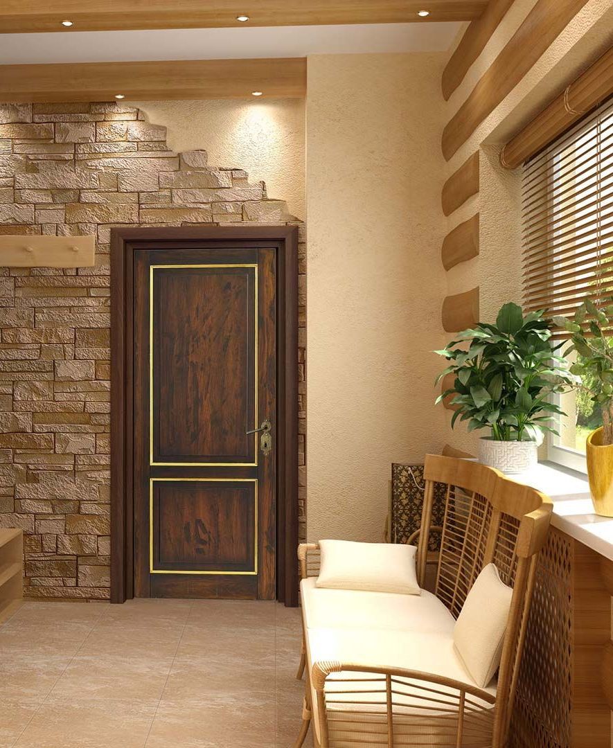 Un soggiorno con una porta di legno, un divano e una finestra.