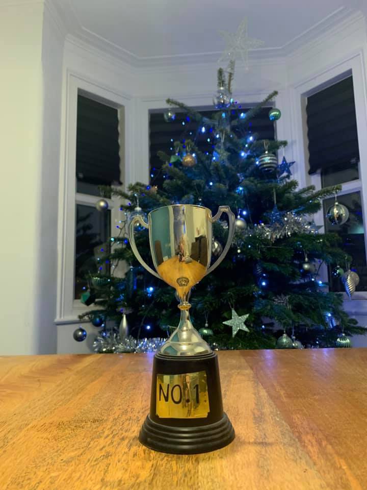 Silver trophy on a wooden table, 