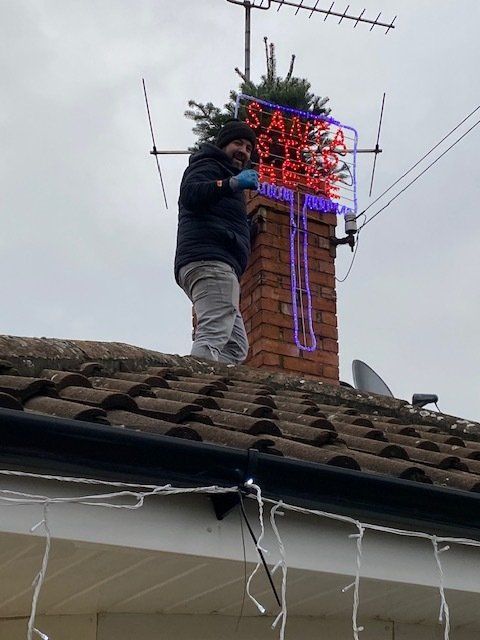 Man on a roof installing a 