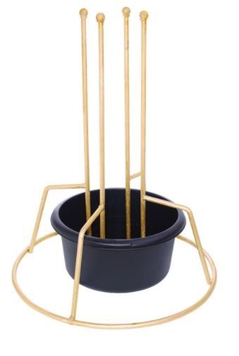 Gold metal Christmas tree stand with a black plastic water container.