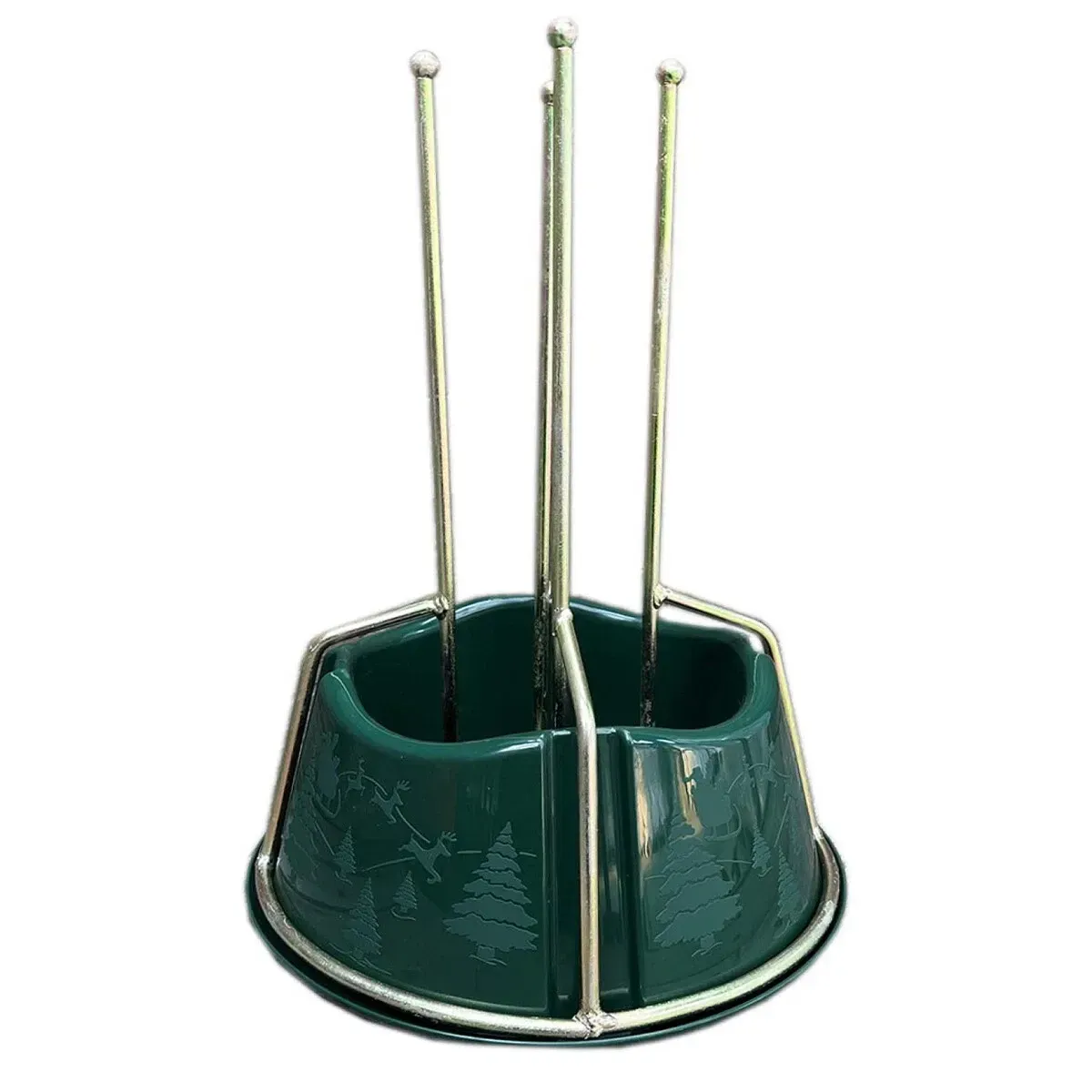 Gold metal Christmas tree stand with a green decorative  plastic water container.