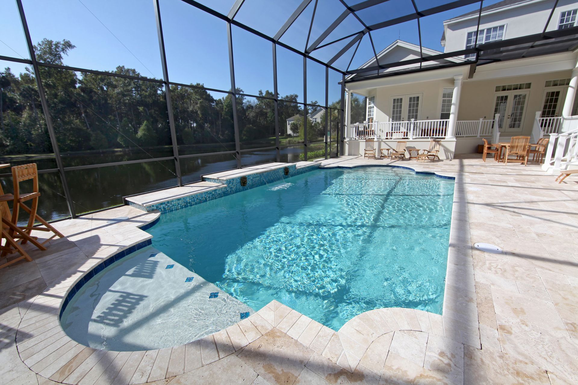 Modern inground pool in a spacious backyard setting