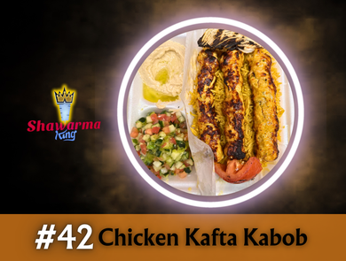 Chicken Kafta Kabob meal in a white container with hummus, salad, and grilled tomato.