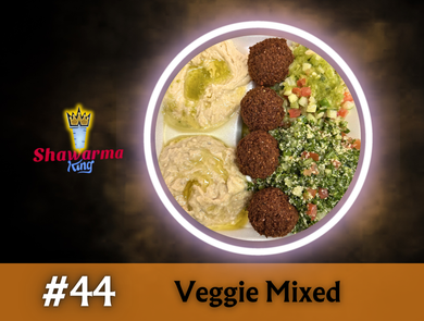 A plate of veggie mixed: hummus, falafel, cucumber, and tabouleh salad.  Black background, bright white ring light.