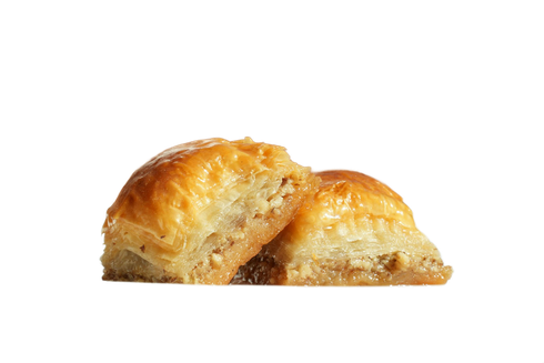 Chopped vegetable salad with cucumbers, tomatoes, and herbs in a black bowl.