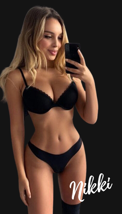 A woman in lingerie is taking a selfie with her phone