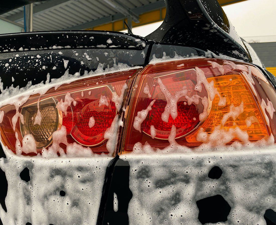 car's rear lights covered in soap suds