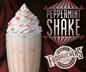 A peppermint shake with whipped cream and candy canes