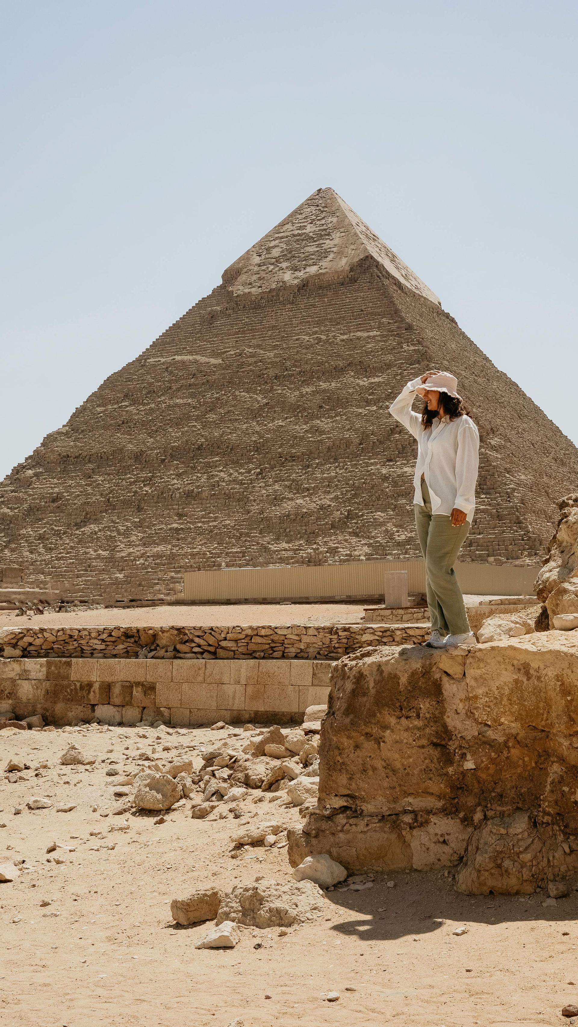 Traveler standing beside the Great Pyramid of Giza