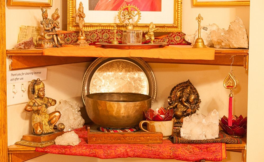 The puja in the back corner of the WYC with sound bowls, crystals, hanuman and other deities.