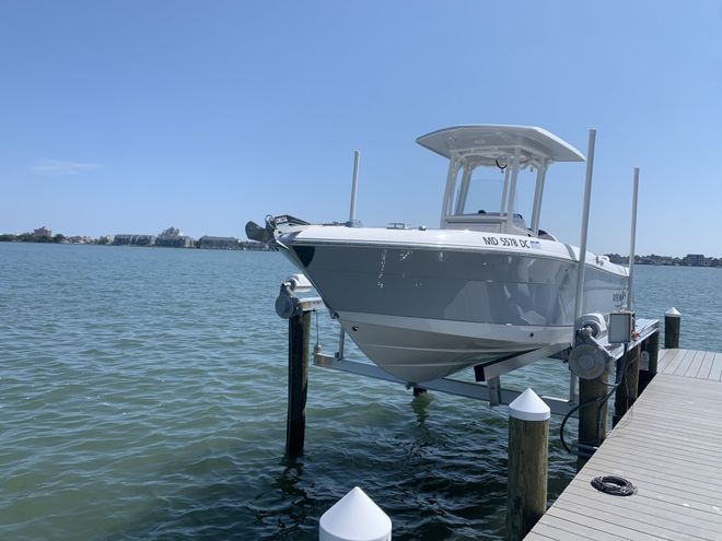 Shiny gray boat in a dock | Ocean City, MD | Ocean City Boat Lifts