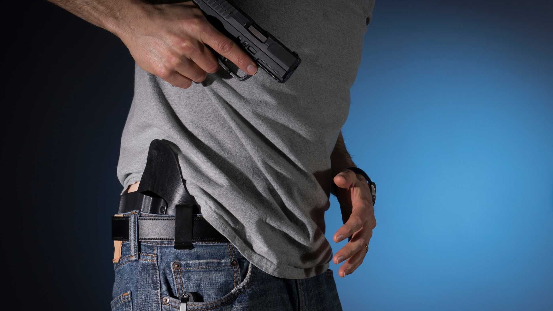 man carrying a concealed firearm