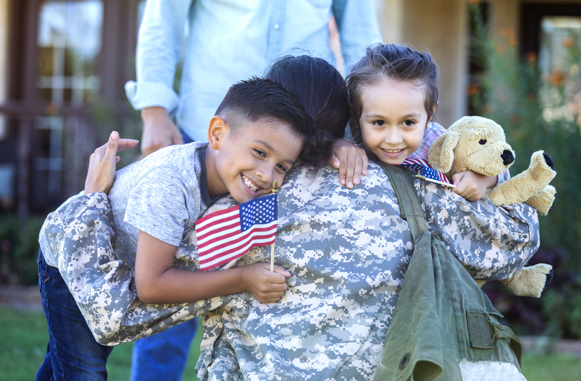 A group of people are sitting in a circle talking to each other.