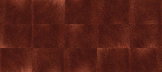 Eine Nahaufnahme eines Holzbodens mit Schachbrettmuster.