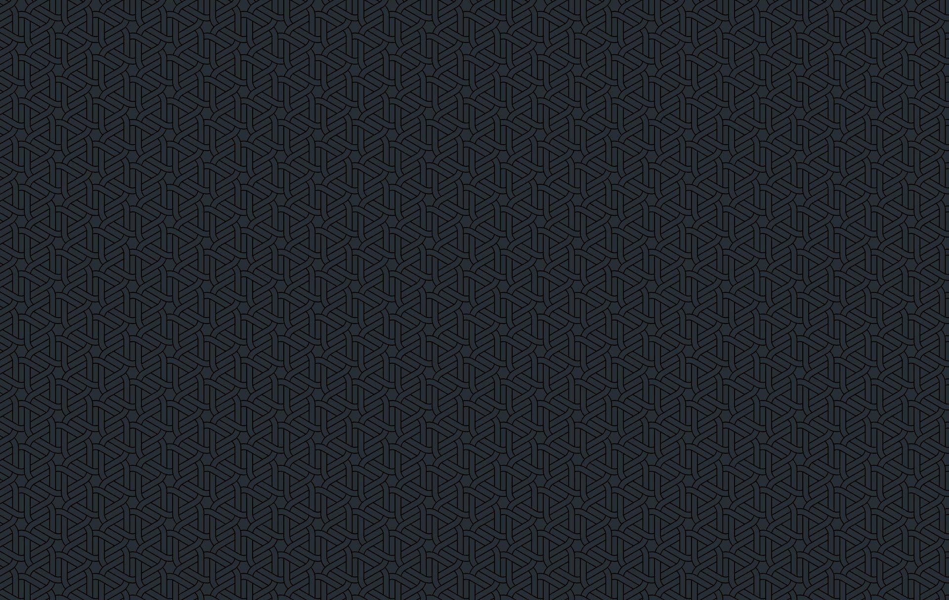 Fondo texturizado gris oscuro con un patrón repetido.