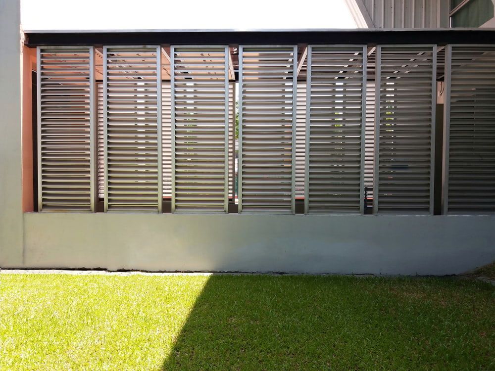 Louvered Metal Panels on a Building Wall — A & B Lattice World & Patios in Bungalow, QLD