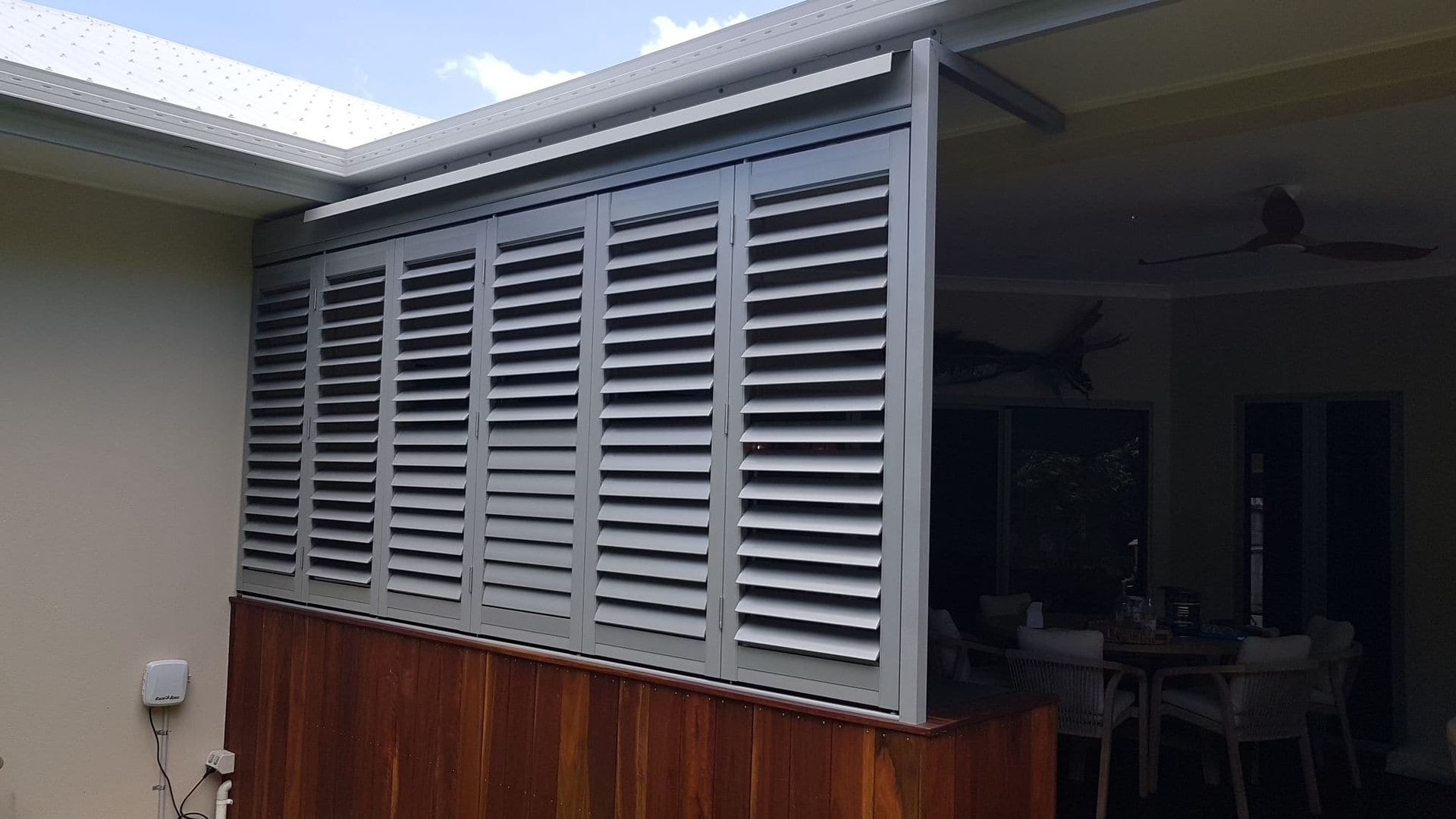 A House With a Aluminum Fence and Louvres on the Side of It — A & B Lattice World & Patios In Tablelands, QLD
