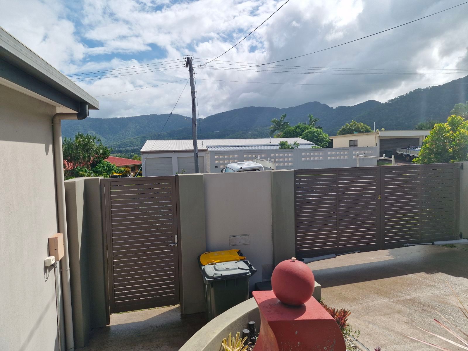 A Building with A Fence in Front of It and A Sliding Glass Door  — A & B Lattice World & Patios in Bungalow, QLD
