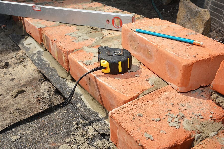 a brick wall being built with a saw