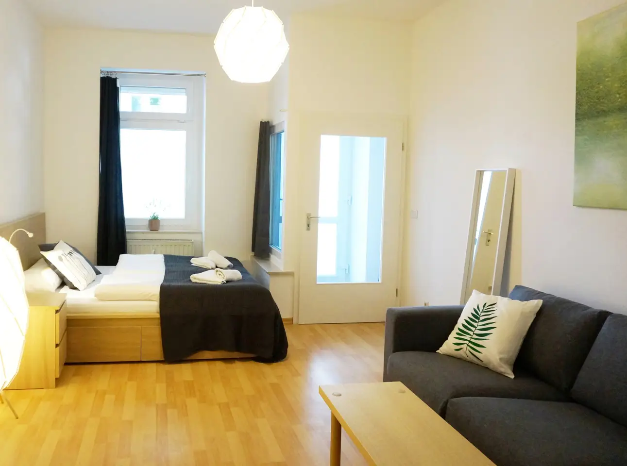 Bedroom and entrance to the holiday apartment