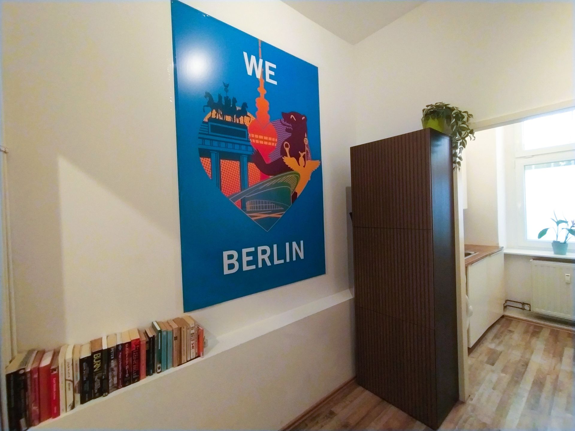 Dining area with little library / book exchange and love Berlin Poster