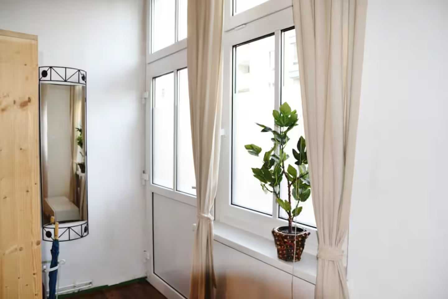 Bedroom with view to the kitchen-living room area of our holiday rental