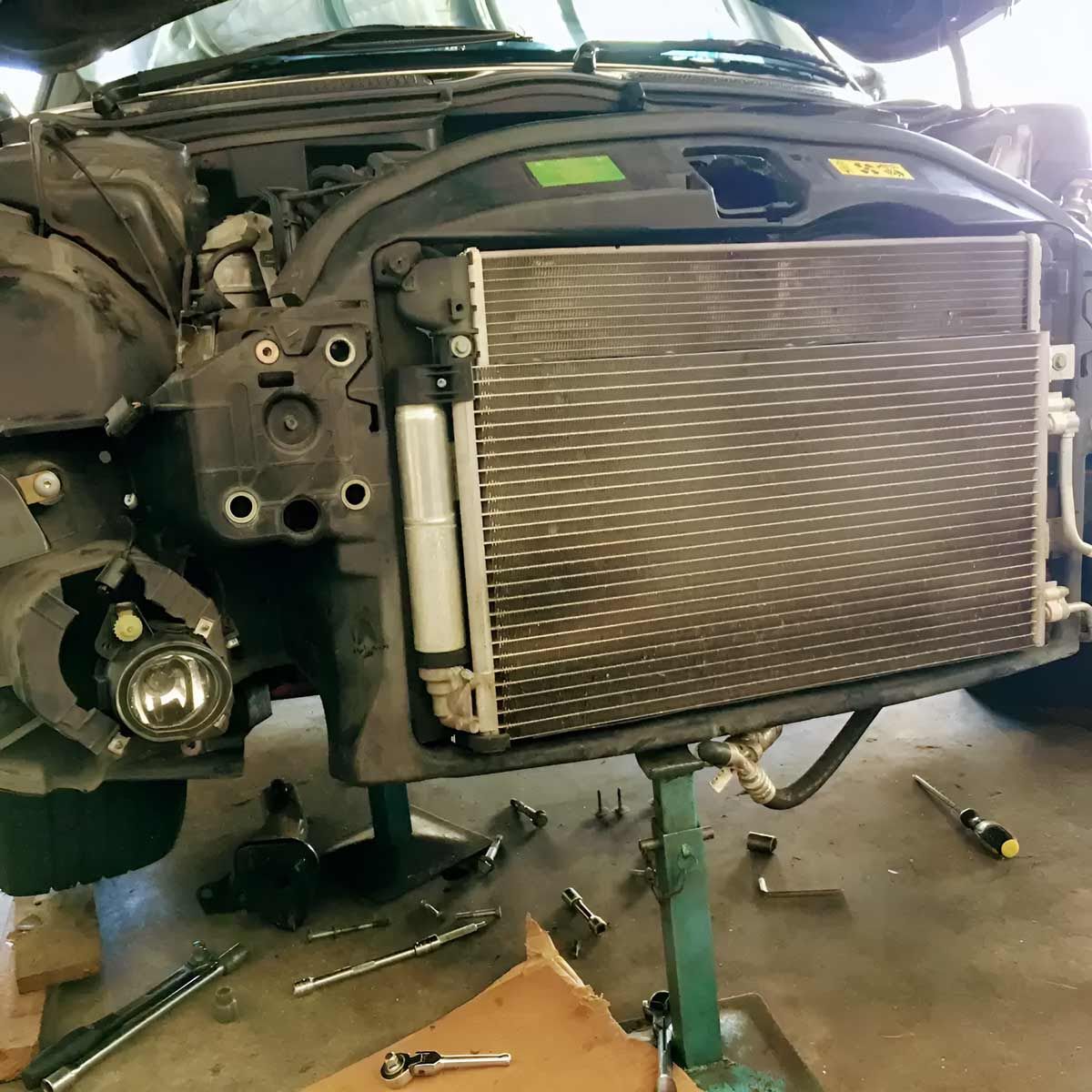 A Car Is Being Worked On With The Radiator Removed — Barron River Auto Electrics & Air-conditioning in Stratford, QLD
