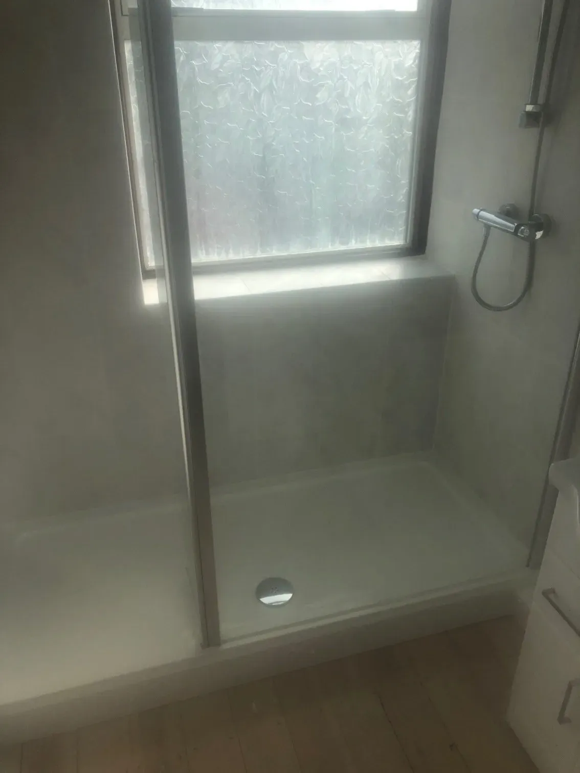 Walk in shower installation with tiled walls