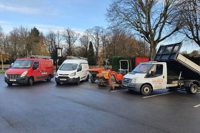 T.A Smith Builders Ltd Company vans and building equipment in carpark